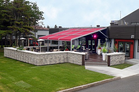 Cocktails and drinks are served on the outdoor terrace at Quality Inn Matane